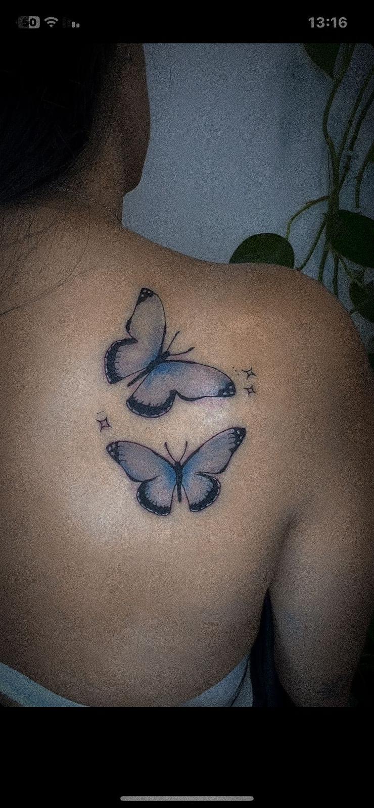 Paw print tattoo on leg